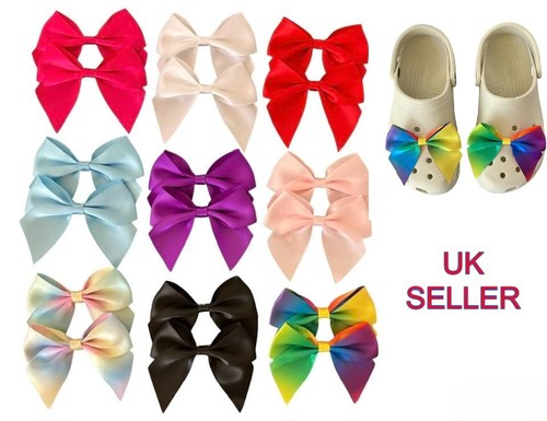 Pair large satin bow - of, shoe